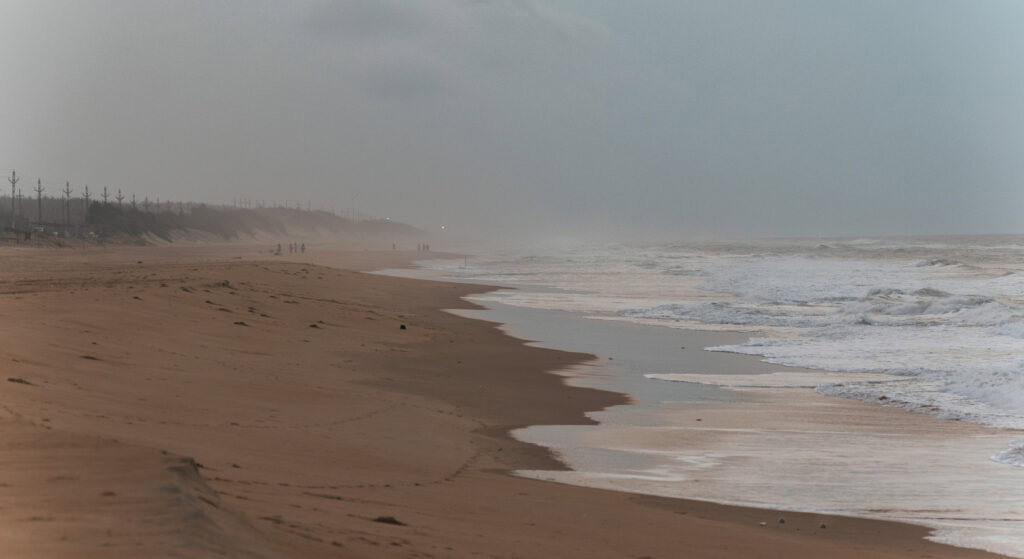 Frothy waves crashing on the sand.