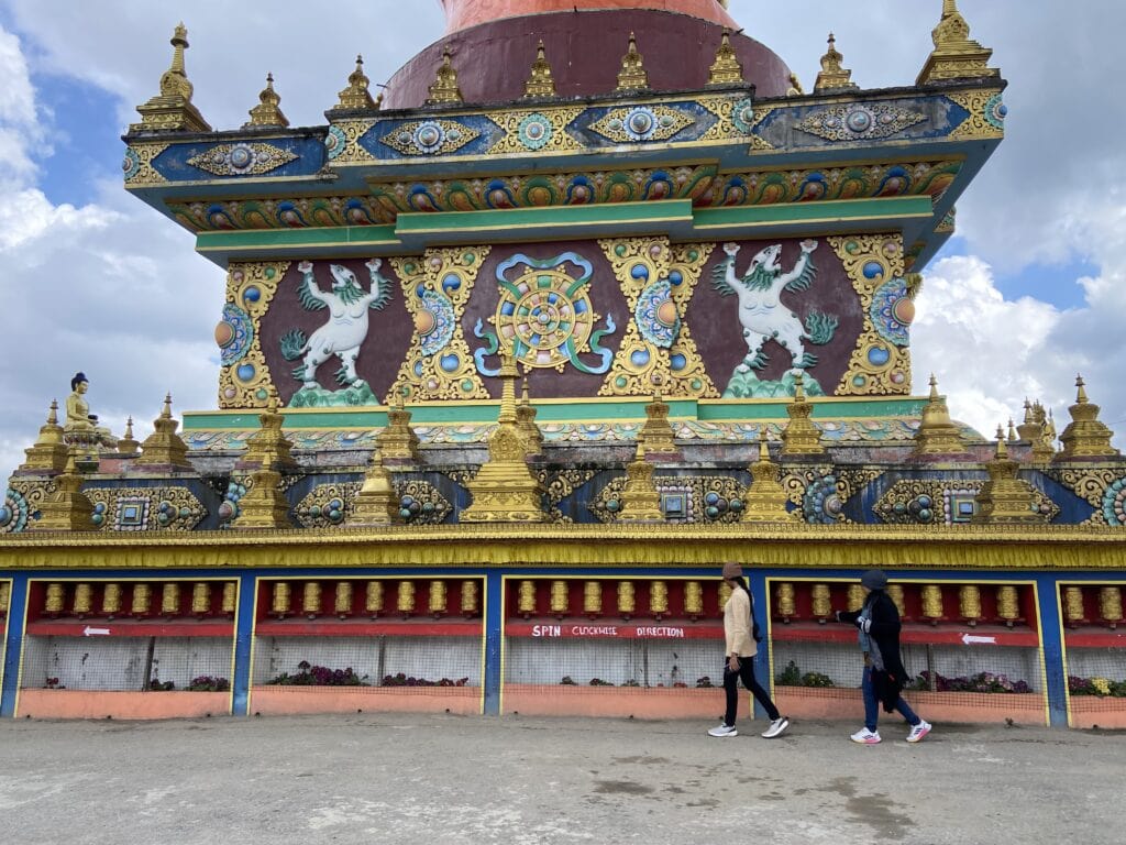 Prayer wheels at the base of Giant Buddha